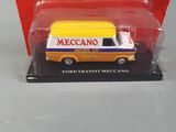 yellow and white truck in a red box on a gray surface