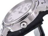 a close up of a watch on a black stand