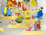 a lot of cartoon characters that are on the stairs