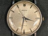 a close up of a watch with roman numerals on the face