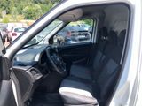 the interior of a car with the door open and the driver ' s seat down