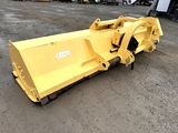 an image of a yellow snow plow in a parking lot