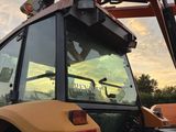 a tractor that is parked on the side of the road