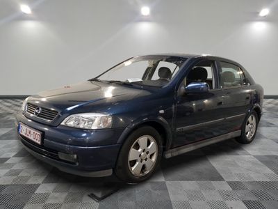 a picture of a blue car parked in a garage