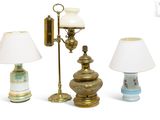 three different lamps are sitting next to each other on a white surface
