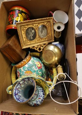 a cardboard box filled with assorted items on the floor