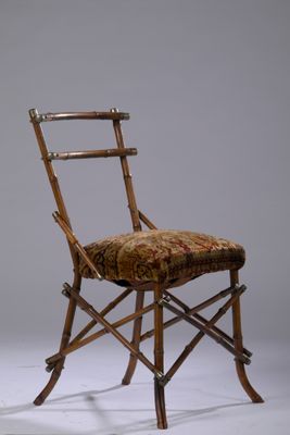 a wooden chair with a floral upholstered seat and back