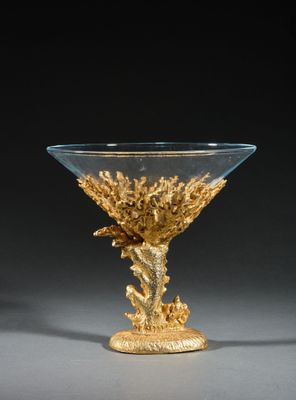 an image of a glass bowl with a gold decoration on it