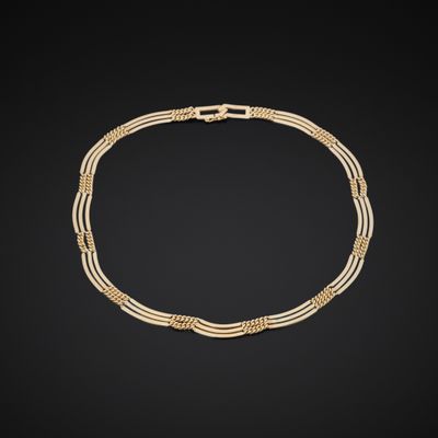 a gold and diamond necklace, by business