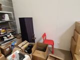 a room filled with boxes and a television in it