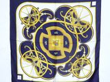 a blue and yellow square scarf with a design of bicycles