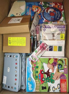 a cardboard box filled with toys and other items