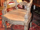 a chair that is sitting on a rug in a room