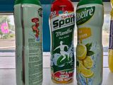 bottles of soda, lemonade, and lemonade are on display in a store