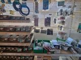 a room with a lot of different items on the shelves