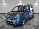 a small blue car that is parked on a checkered floor