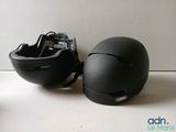 a helmet and a cell phone sitting on a table