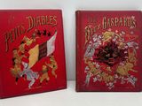 Deux livres sont posés sur une surface blanche ; l'un d'eux a une couverture rouge.