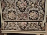 a white dresser with a floral design on it