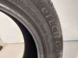 a close up of a tire on a white surface