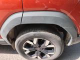 a close up of a car ' s tire on the road