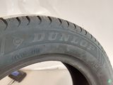 the tire of a car is shown on the side of the wall