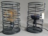 two lamps that are sitting next to each other on a table