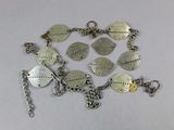 a bracelet that has a lot of charms on it