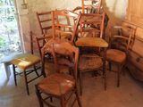 many chairs and a dresser in a room