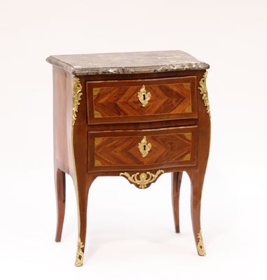 a small wooden table with a marble top on it