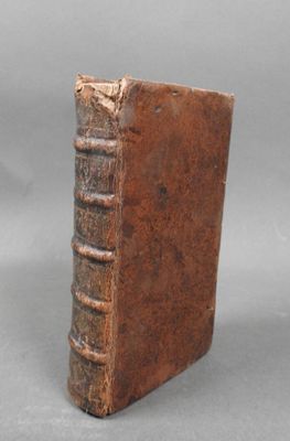 an old book that is sitting on a table