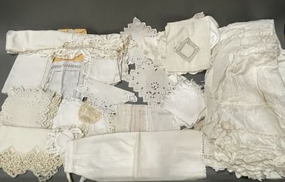 many pieces of clothing that are on a table