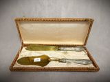three silverware in a box on a table