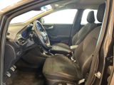 the interior of a car with the door open showing the steering wheel and dashboard