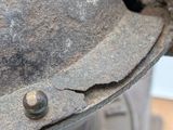 a close up of a metal object with a hole in it