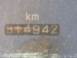 a close up of a speedometer on a car ' s dashboard