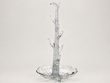 a glass vase with a bird on top of it