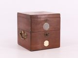 an image of a small wooden box with three drawers