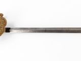 a close up of a sword with a lion head on it