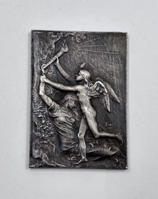 an image of a metal plaque depicting a man with a bow and arrow