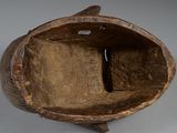 a small wooden object that is sitting on a table