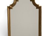 une image d'un miroir encadré d'or sur un fond blanc