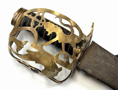 a close up of a sword with a metal handle