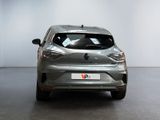 the rear end of a silver car in a white room