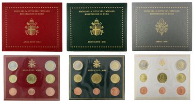 a group of six different colored coins in a box