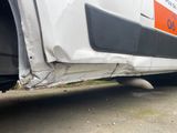 a close up of a car with a flat tire on the road