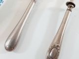 two spoons and a fork on a table