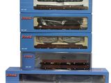 four boxed boxes of toy trains sitting on top of each other
