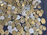 a lot of coins sitting on a table with a price tag