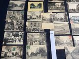 several old black and white photographs of a street and buildings